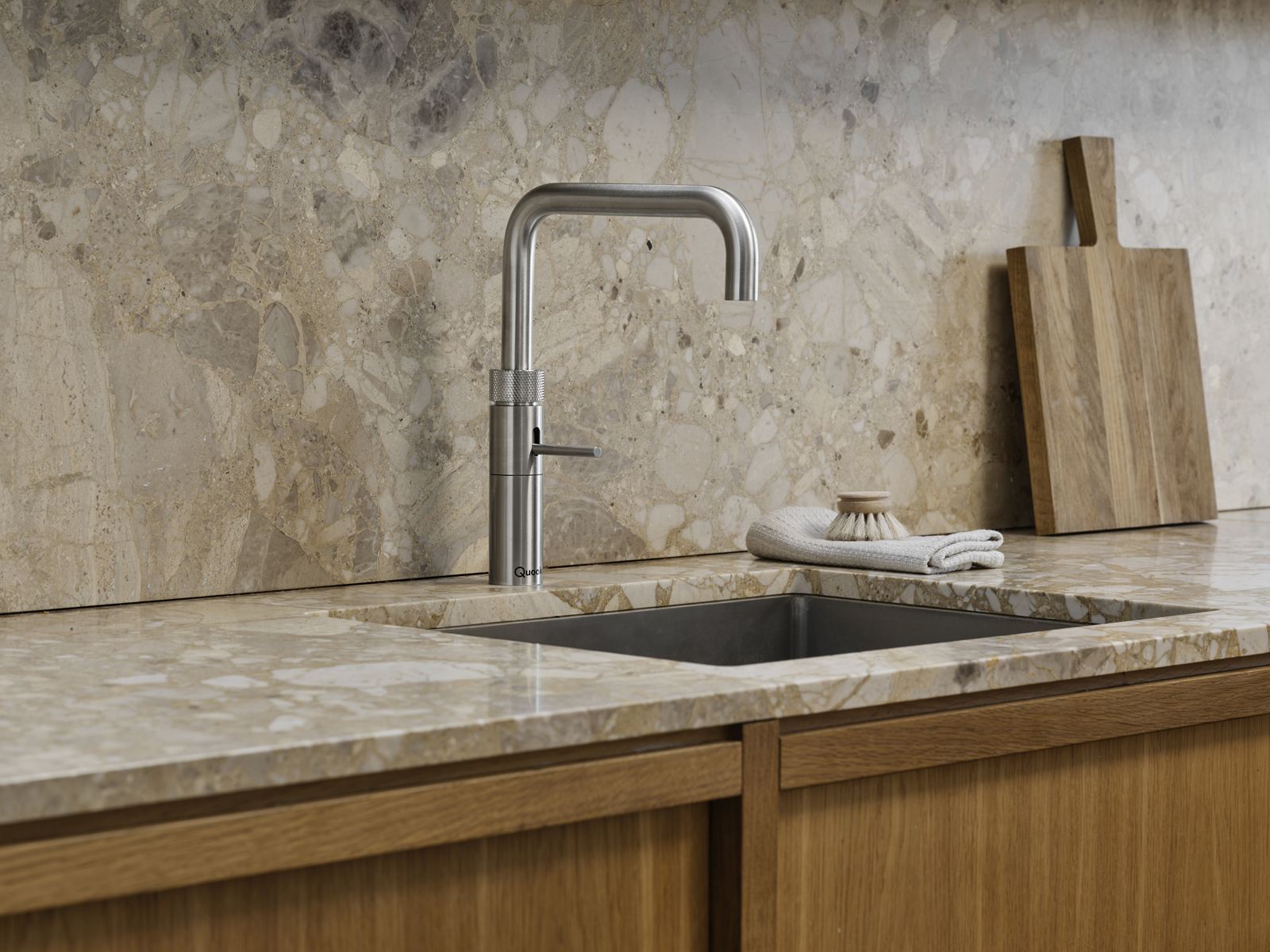Quooker Fusion Square tap in stainless steel above oak kitchen cabinets